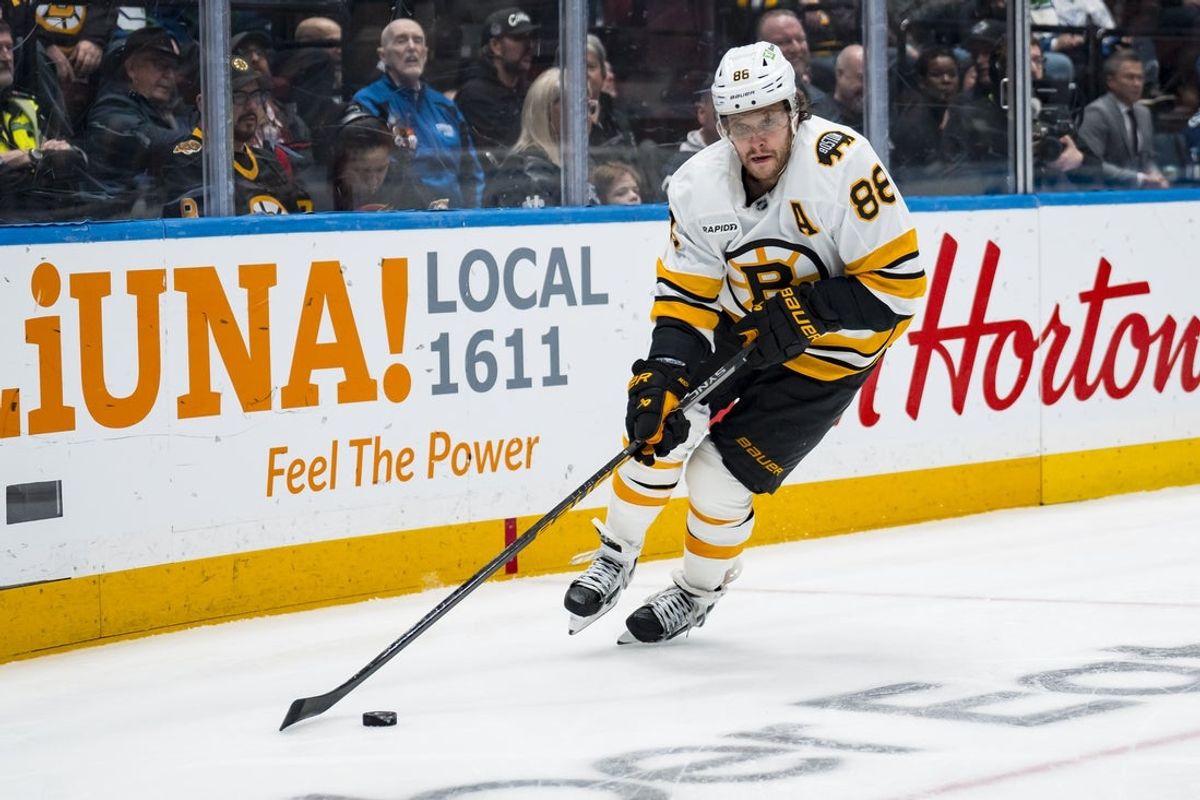 Jan 3, 2026; Vancouver, British Columbia, CAN; Boston Bruins forward David Pastrnak (88) handles the puck against the Vancouver Canucks in the third period at Rogers Arena. Mandatory Credit: Bob Frid-Imagn Images