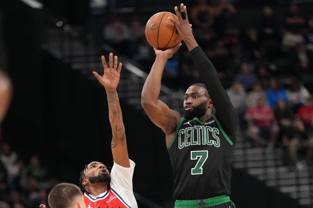 Jan 3, 2026; Inglewood, California, USA; Boston Celtics guard Jaylen Brown (7) shoots the ball against forward Derrick Jones Jr. (5) in the second half at Intuit Dome. Mandatory Credit: Kirby Lee-Imagn Images