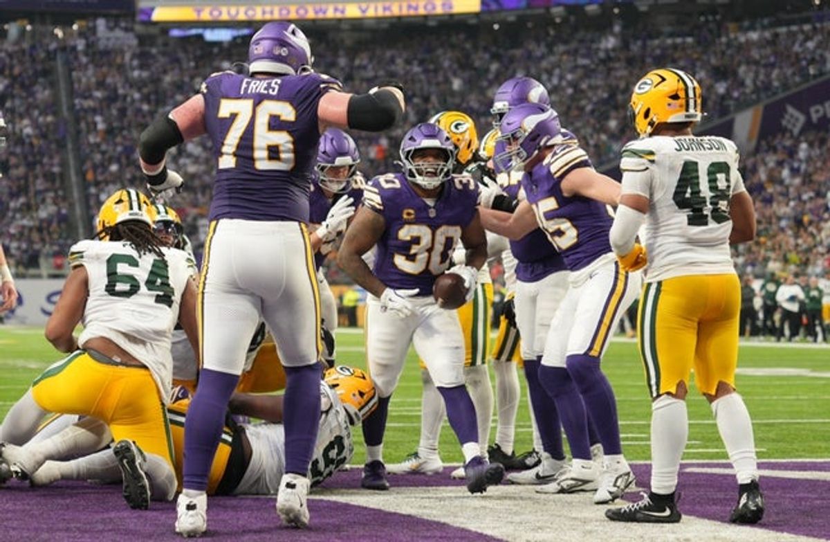 Jan 4, 2026; Minneapolis, Minnesota, USA; Minnesota Vikings fullback C.J. Ham (30) celebrates after a touchdown against the Green Bay Packers during the second quarter at U.S. Bank Stadium. Mandatory Credit: Matt Blewett-Imagn Images