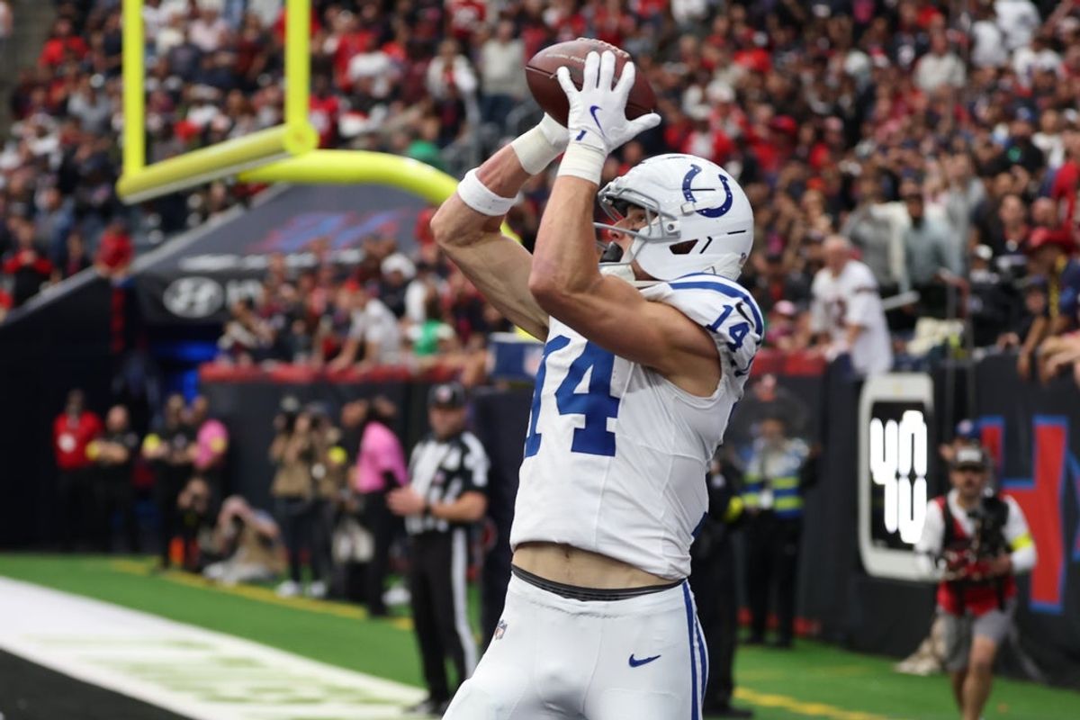 Jan 4, 2026; Houston, Texas, USA;  Indianapolis Colts wide receiver Alec Pierce (14) catches a touchdown pass against the Houston Texans during the first half at NRG Stadium. Mandatory Credit: Thomas Shea-Imagn Images