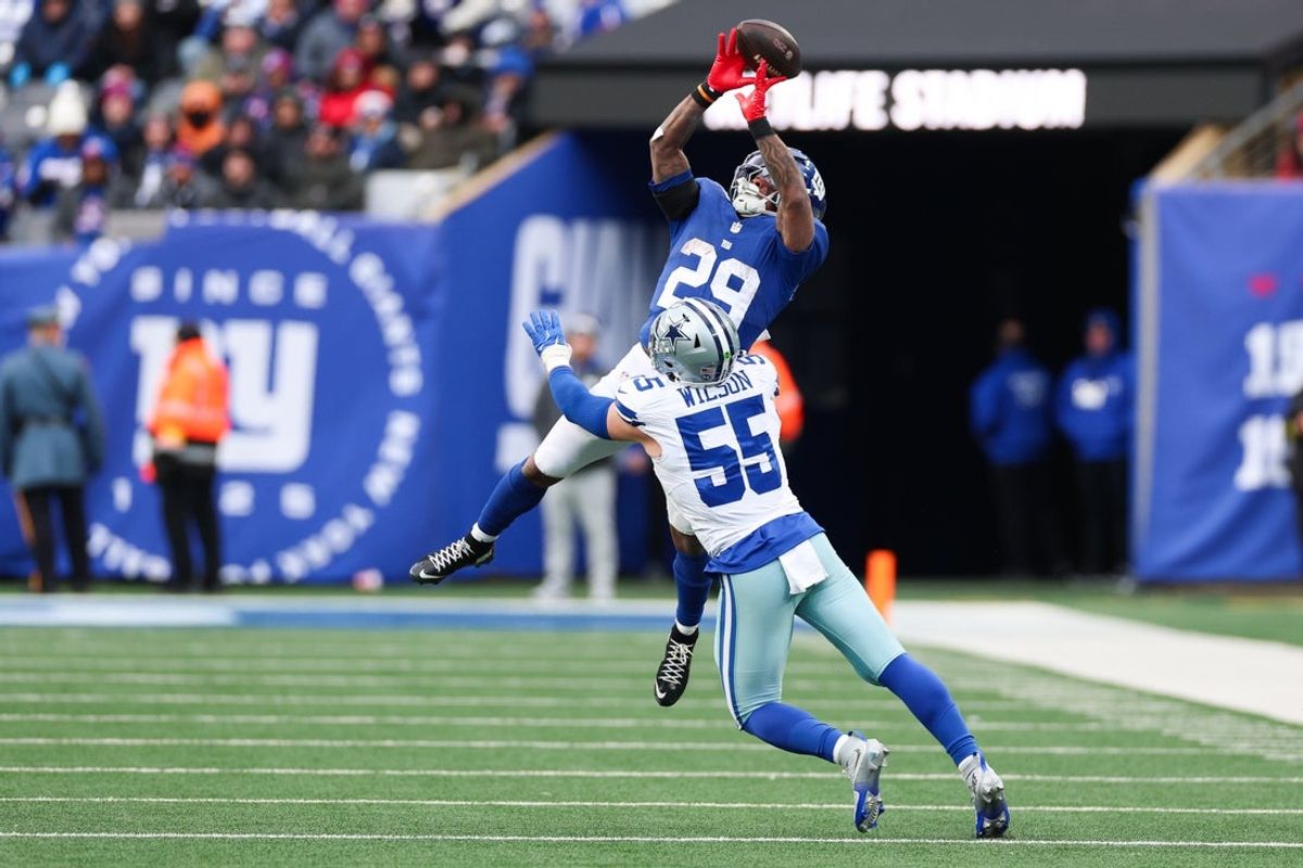 Jan 4, 2026; East Rutherford, New Jersey, USA; Dallas Cowboys linebacker Logan Wilson (55) breaks up a pass intended for New York Giants running back Tyrone Tracy Jr. (29) during the fourth quarter at MetLife Stadium. Mandatory Credit: Vincent Carchietta-Imagn Images