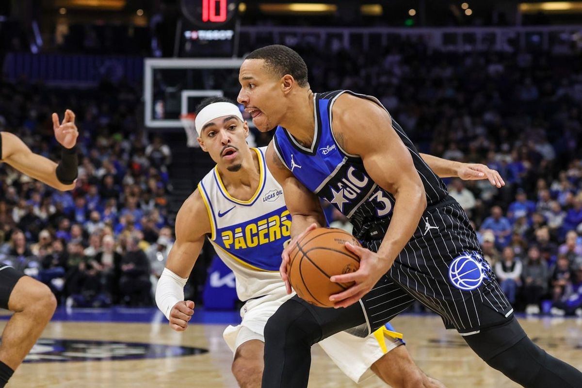 Jan 4, 2026; Orlando, Florida, USA; Orlando Magic guard Desmond Bane (3) drives to the basket against Indiana Pacers guard Andrew Nembhard (2) during the first quarter at Kia Center. Mandatory Credit: Mike Watters-Imagn Images