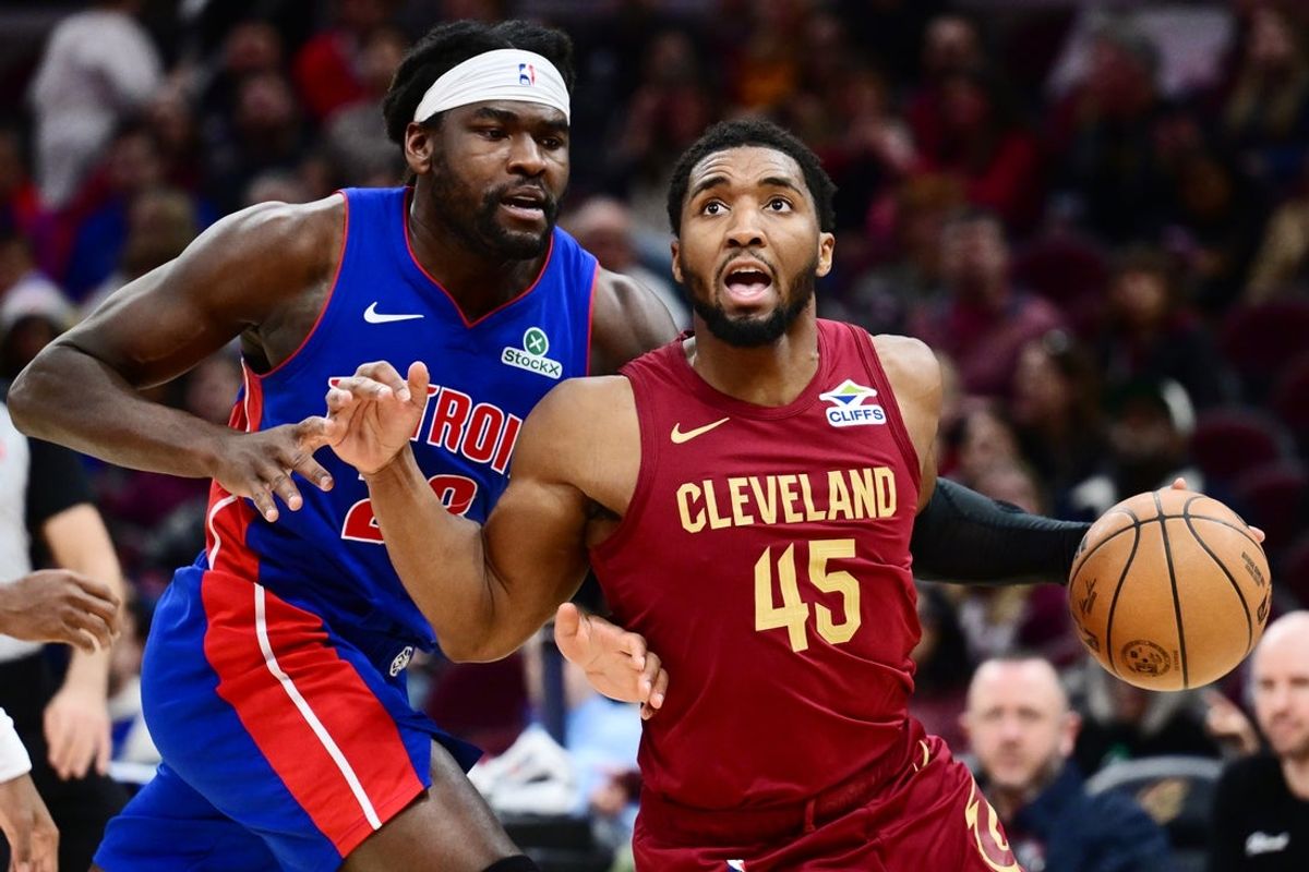 Jan 4, 2026; Cleveland, Ohio, USA; Cleveland Cavaliers guard Donovan Mitchell (45) drives to the basket against Detroit Pistons forward Isaiah Stewart (28) during the second half at Rocket Arena. Mandatory Credit: Ken Blaze-Imagn Images
