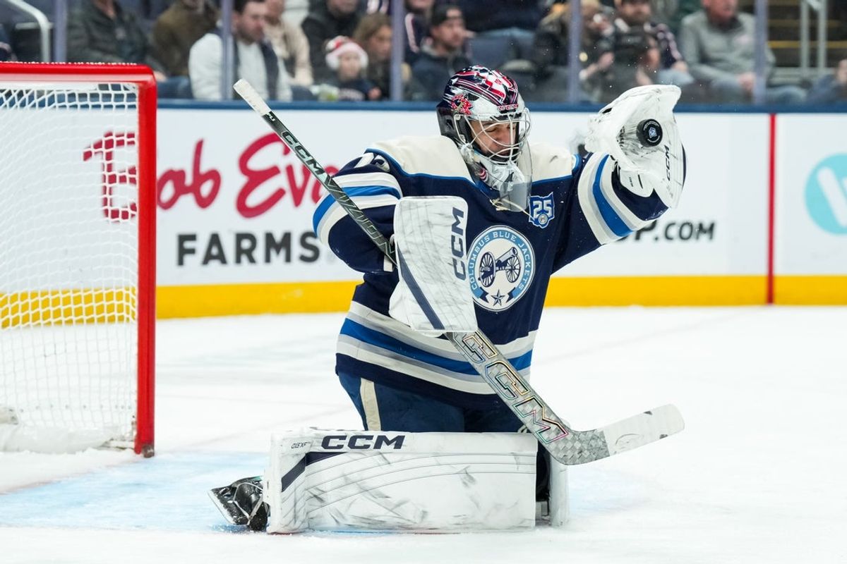 Jan 4, 2026; Columbus, Ohio, USA;  Columbus Blue Jackets goaltender Jet Greaves (73) makes a glove save in net against the Pittsburgh Penguins in the second period at Nationwide Arena. Mandatory Credit: Aaron Doster-Imagn Images