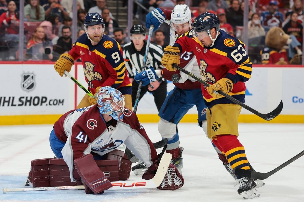 Jan 4, 2026; Sunrise, Florida, USA; Florida Panthers left wing Brad Marchand (63) attempts to score against Colorado Avalanche goaltender Scott Wedgewood (41) during the first period at Amerant Bank Arena. Mandatory Credit: Sam Navarro-Imagn Images
