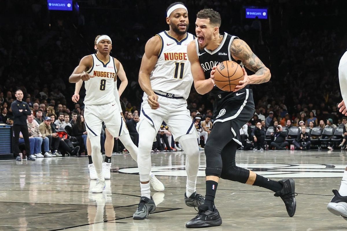 Jan 4, 2026; Brooklyn, New York, USA;  Brooklyn Nets forward Michael Porter Jr. (17) looks to drive past Denver Nuggets guard Bruce Brown (11) in the third quarter at Barclays Center. Mandatory Credit: Wendell Cruz-Imagn Images