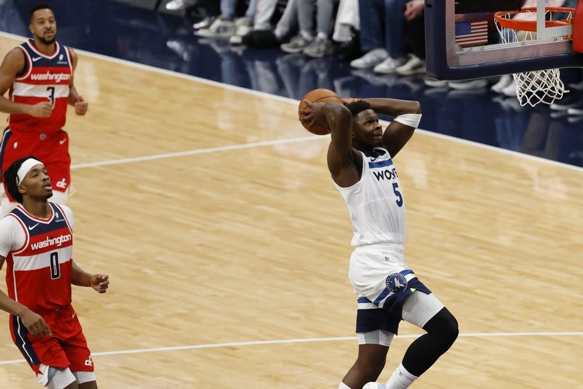 Jan 4, 2026; Washington, District of Columbia, USA; Minnesota Timberwolves guard Anthony Edwards (5) dunks the ball as Washington Wizards guard Bilal Coulibaly (0) looks on in the first quarter at Capital One Arena. Mandatory Credit: Geoff Burke-Imagn Images