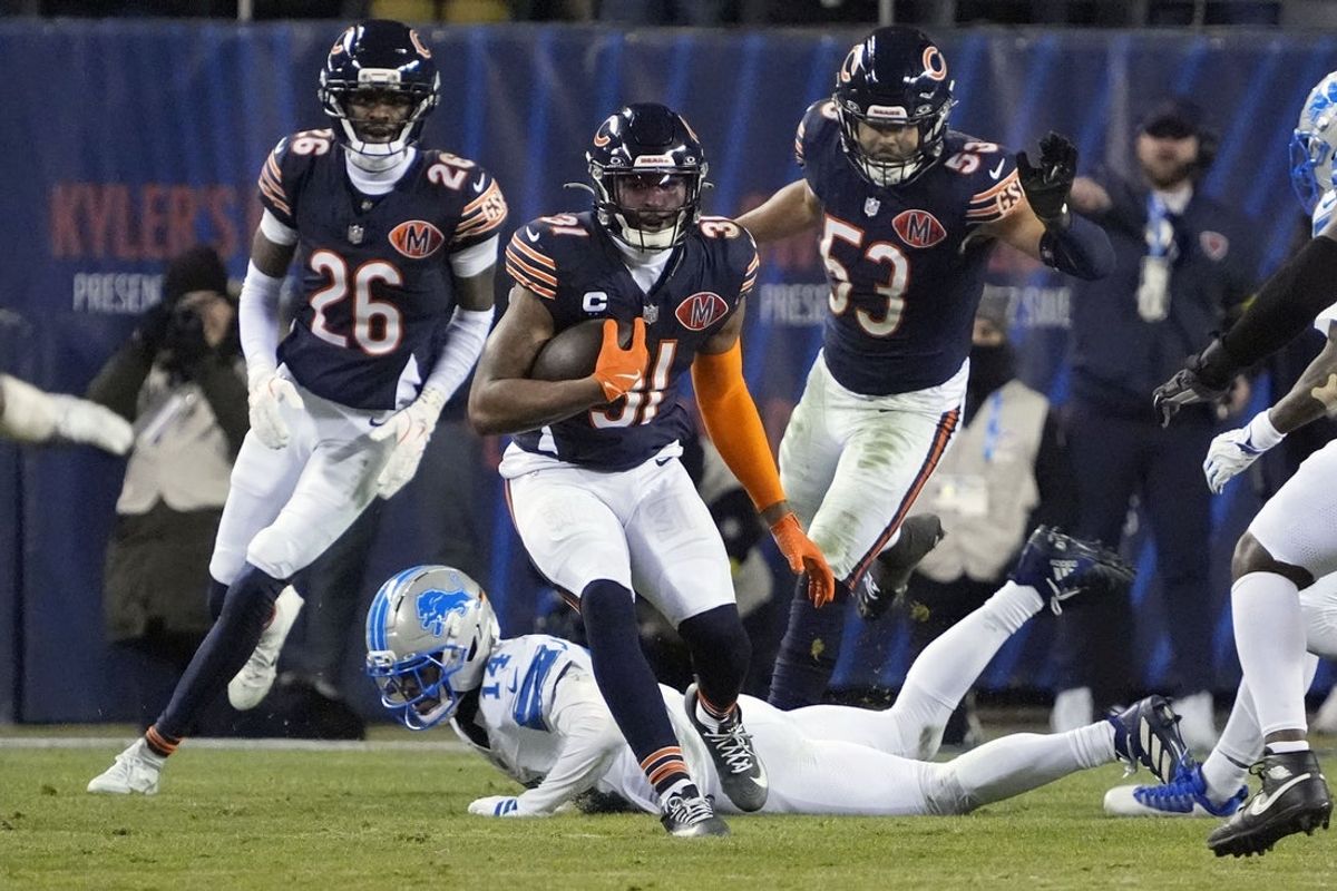 Jan 4, 2026; Chicago, Illinois, USA; Chicago Bears safety Kevin Byard III (31) runs with the ball after making an interception against the Detroit Lions during the second half at Soldier Field. Mandatory Credit: David Banks-Imagn Images