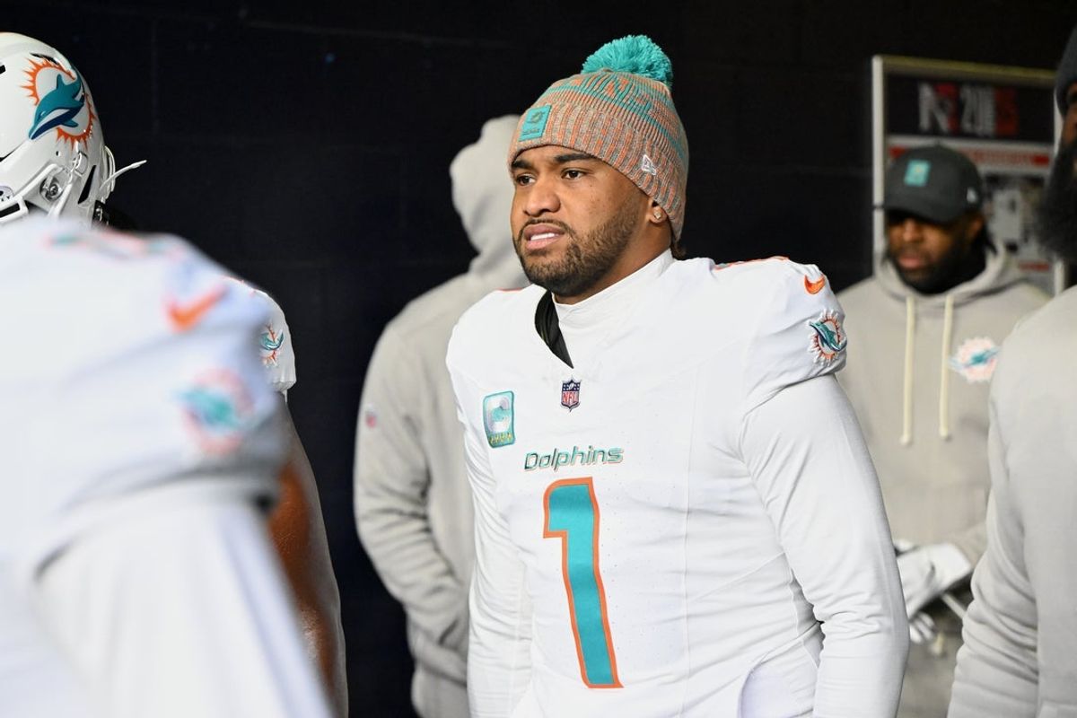 Jan 4, 2026; Foxborough, Massachusetts, USA; Miami Dolphins quarterback Tua Tagovailoa (1) walks out of the player tunnel before the game against the New England Patriots at Gillette Stadium. Mandatory Credit: Brian Fluharty-Imagn Images