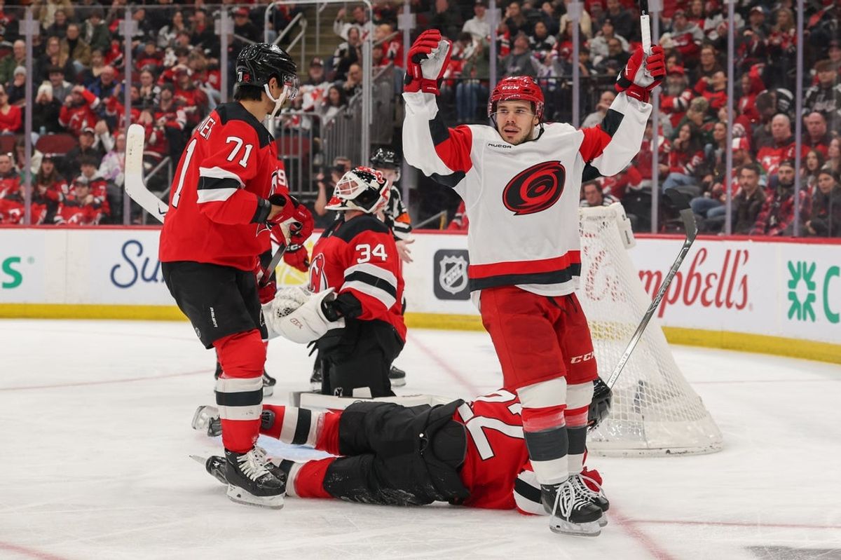 Jan 4, 2026; Newark, New Jersey, USA; Carolina Hurricanes center Logan Stankoven (22) celebrates his goal against the New Jersey Devils during the third period at Prudential Center. Mandatory Credit: Ed Mulholland-Imagn Images
