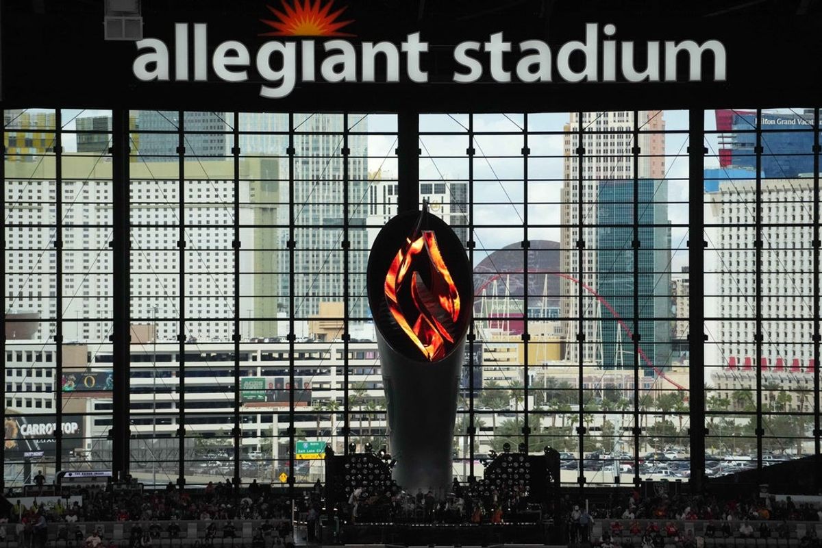 Jan 4, 2026; Paradise, Nevada, USA; The Al Davis memorial torch at Allegiant Stadium with the Las Vegas strip as a backdrop. Mandatory Credit: Kirby Lee-Imagn Images