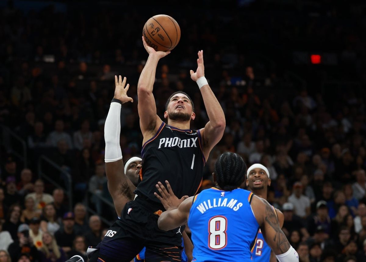 Jan 4, 2026; Phoenix, Arizona, USA; Phoenix Suns guard Devin Booker (1) against the Oklahoma City Thunder in the second half at Mortgage Matchup Center. Mandatory Credit: Mark J. Rebilas-Imagn Images