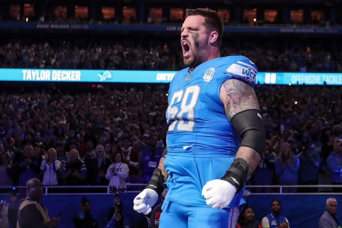 Detroit Lions left tackle Taylor Decker takes the field during player introductions before the Detroit Lions game against the Carolina Panthers at Ford Field in Detroit on Sunday, Oct. 8, 2023.