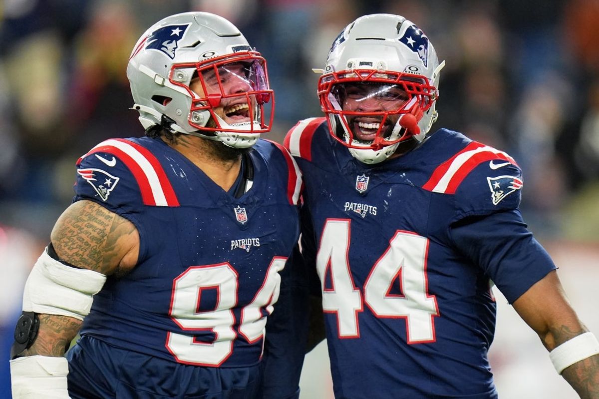 Jan 4, 2026; Foxborough, Massachusetts, USA; New England Patriots defensive tackle Cory Durden (94) celebrates with linebacker K'Lavon Chaisson (44) against the Miami Dolphins during the third quarter at Gillette Stadium. Mandatory Credit: David Butler II-Imagn Images