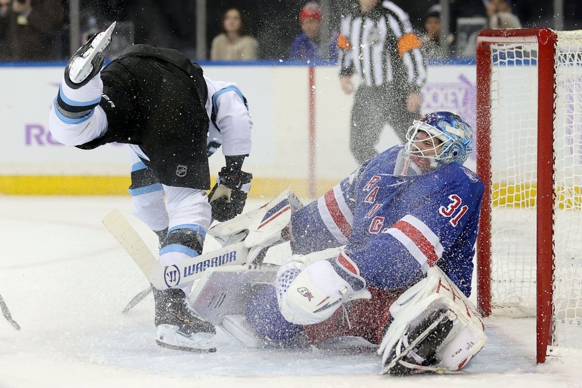 Jan 5, 2026; New York, New York, USA; New York Rangers goaltender Igor Shesterkin (31) reacts after being skated into by Utah Mammoth right wing JJ Peterka (77) during the first period at Madison Square Garden. Shesterkin left the game with an injury after the play. Mandatory Credit: Brad Penner-Imagn Images