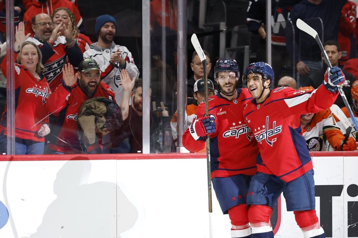 Jan 5, 2026; Washington, District of Columbia, USA; Washington Capitals right wing Justin Sourdif (34) celebrates with Capitals defenseman Matt Roy (3) after scoring a goal against the Anaheim Ducks during the first period at Capital One Arena. Mandatory Credit: Geoff Burke-Imagn Images