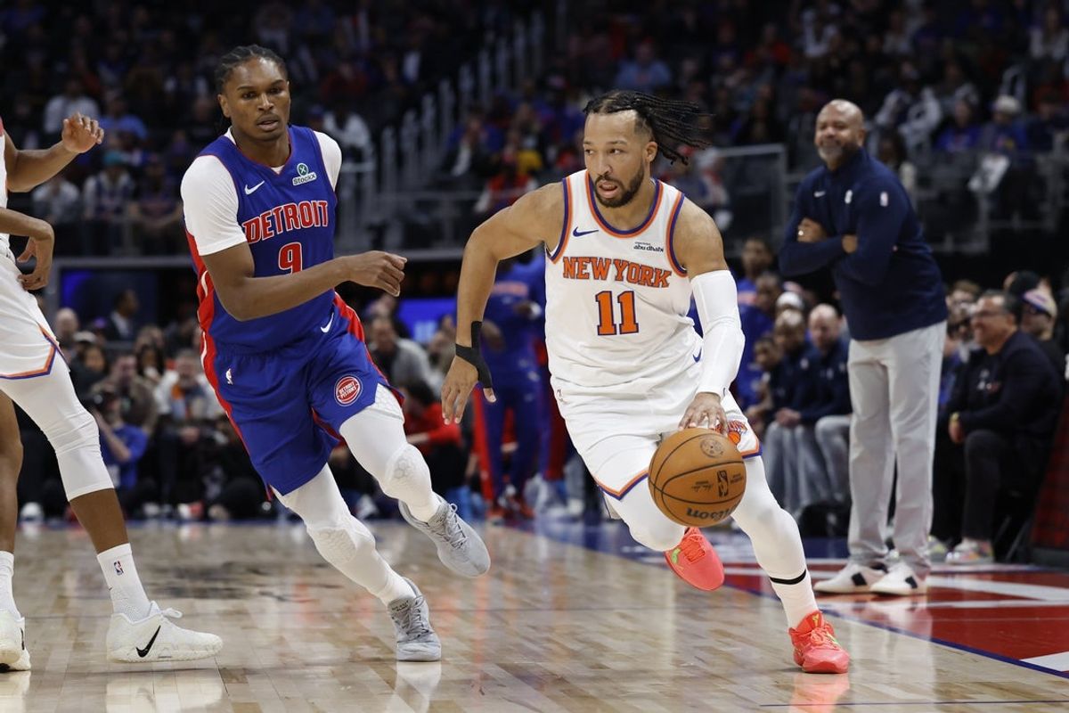 Jan 5, 2026; Detroit, Michigan, USA;  New York Knicks guard Jalen Brunson (11) dribbles on Detroit Pistons guard Ausar Thompson (9) in the first half at Little Caesars Arena. Mandatory Credit: Rick Osentoski-Imagn Images