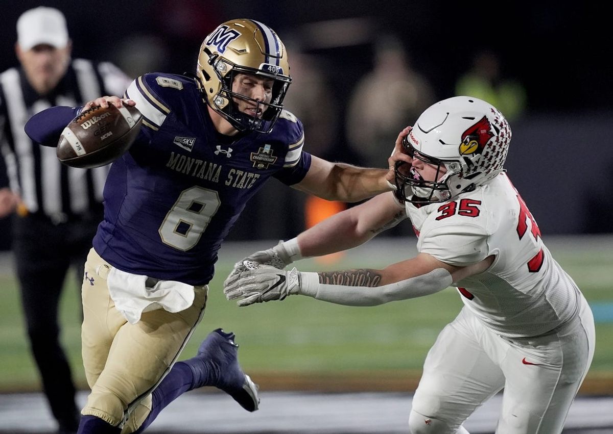 Montana State quarterback Justin Lamson (8) runs past Illinois State linebacker Anthony Corona (35) during the first half of the FCS National Championship game at FirstBank Stadium in Nashville, Tenn., Monday, Jan. 5, 2026.
