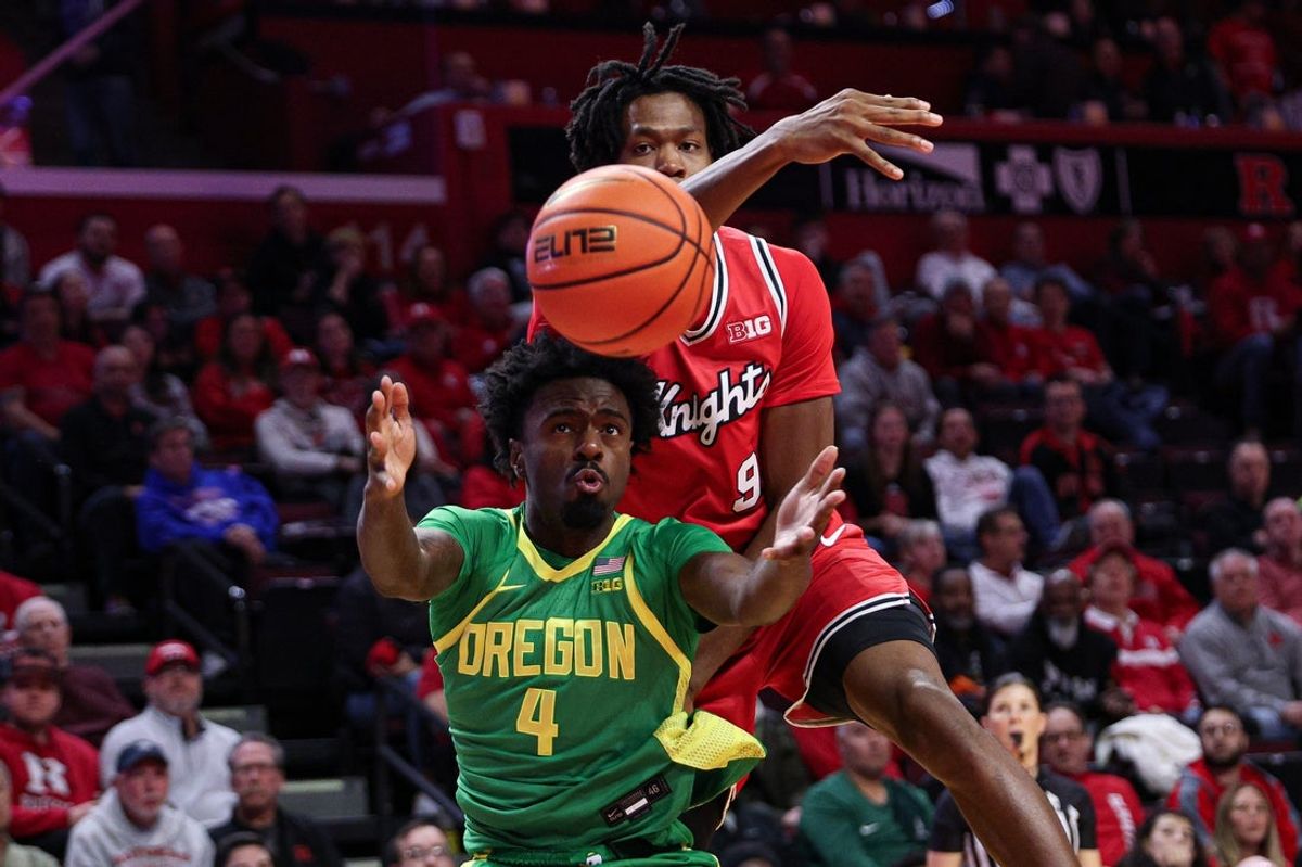 Jan 5, 2026; Piscataway, New Jersey, USA; Rutgers Scarlet Knights forward Dylan Grant (9) rebounds against Oregon Ducks forward Dezdrick Lindsay (4) during the second half at Jersey Mike's Arena. Mandatory Credit: Vincent Carchietta-Imagn Images