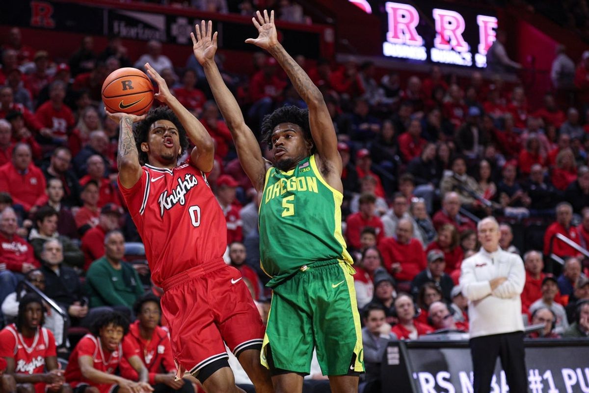 Jan 5, 2026; Piscataway, New Jersey, USA; Rutgers Scarlet Knights guard Tariq Francis (0) shoots the ball after being fouled by Oregon Ducks guard Takai Simpkins (5) during the second half at Jersey Mike's Arena. Mandatory Credit: Vincent Carchietta-Imagn Images