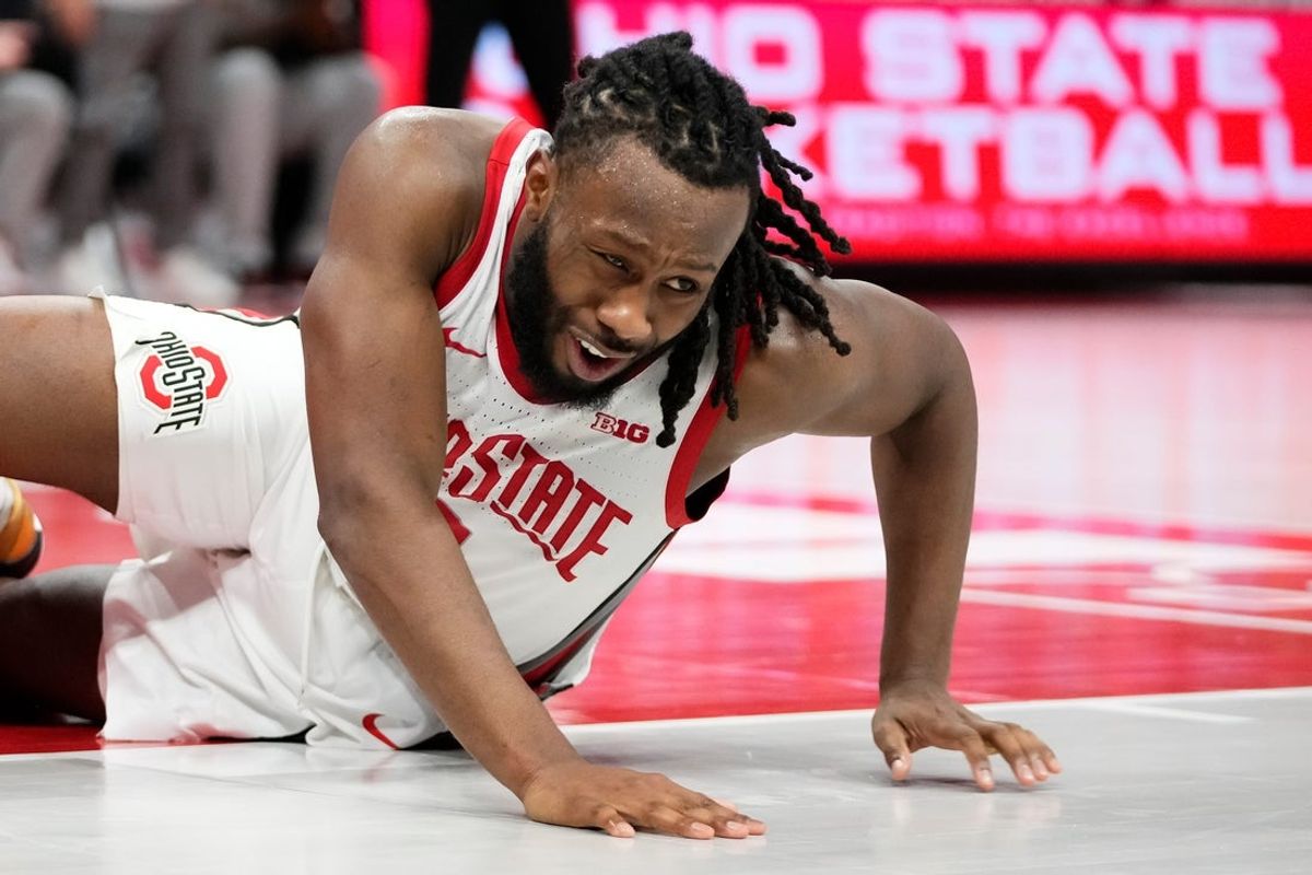 Ohio State Buckeyes guard Bruce Thornton (2) falls to the court after making contact with a Nebraska Cornhuskers player during the second half of the NCAA men's basketball game at the Schottenstein Center in Columbus on Jan. 5, 2026. Ohio State lost 72-69.