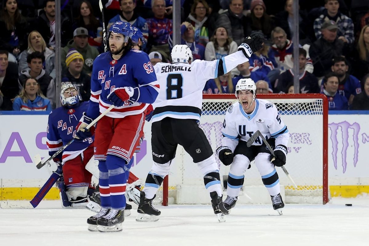 Jan 5, 2026; New York, New York, USA; Utah Mammoth defenseman Sean Durzi (50) celebrates his game winning goal against New York Rangers goaltender Jonathan Quick (32) and center Mika Zibanejad (93) with center Nick Schmaltz (8) during overtime at Madison Square Garden. Mandatory Credit: Brad Penner-Imagn Images