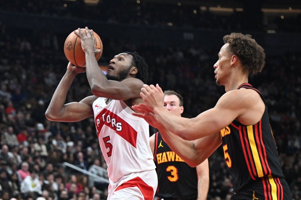 Jan 5, 2026; Toronto, Ontario, CAN; Toronto Raptors guard Immanuel Quickley (5) shoots the ball as Atlanta Hawks guard Dyson Daniels (5) defends in the second half at Scotiabank Arena. Mandatory Credit: Dan Hamilton-Imagn Images