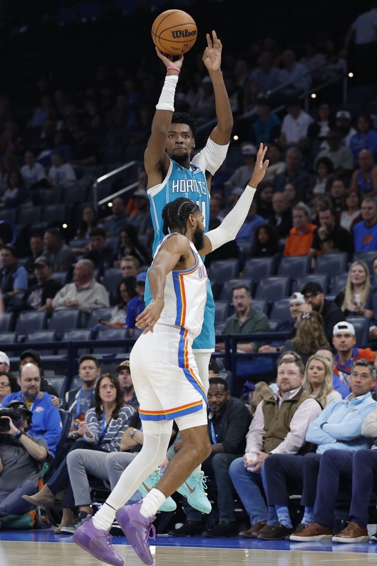 Jan 5, 2026; Oklahoma City, Oklahoma, USA; Charlotte Hornets forward Brandon Miller (24) shoots over Oklahoma City Thunder guard Isaiah Joe (11) during the second half at Paycom Center. Mandatory Credit: Alonzo Adams-Imagn Images