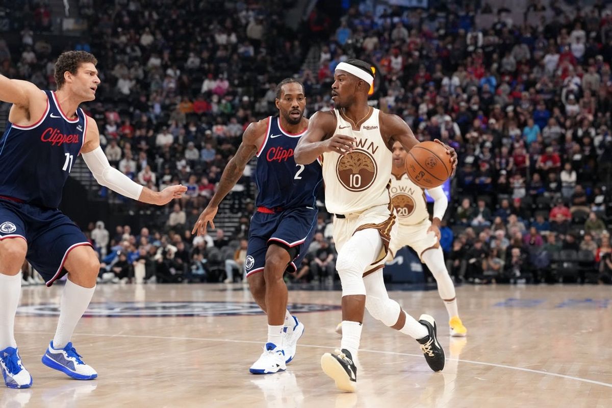 Jan 5, 2026; Inglewood, California, USA; Golden State Warriors forward Jimmy Butler III (10) dribbles the ball against LA Clippers center Brook Lopez (11) and forward Kawhi Leonard (2) in the first half at Intuit Dome. Mandatory Credit: Kirby Lee-Imagn Images