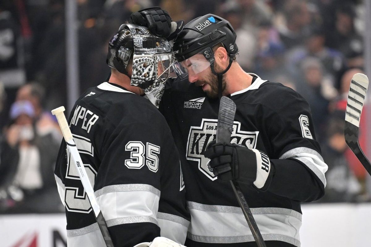 Jan 5, 2026; Los Angeles, California, USA; Los Angeles Kings goaltender Darcy Kuemper (35) is congratulated by defenseman Joel Edmundson (6) after the game against the Minnesota Wild at Crypto.com Arena. Mandatory Credit: Jayne Kamin-Oncea-Imagn Images