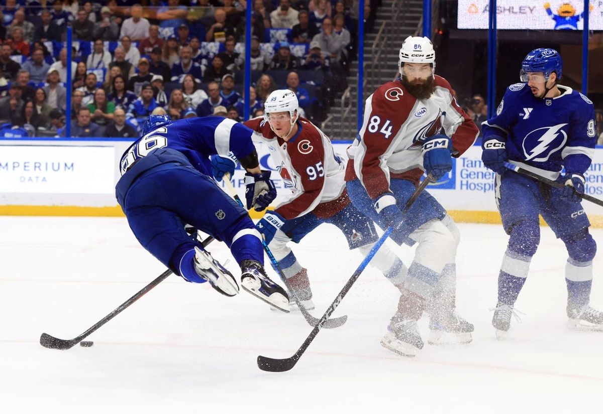 Jan 6, 2026; Tampa, Florida, USA; Colorado Avalanche defenseman Brent Burns (84) trips up Tampa Bay Lightning right wing Nikita Kucherov (86) during the first period at Benchmark International Arena. Mandatory Credit: Kim Klement Neitzel-Imagn Images
