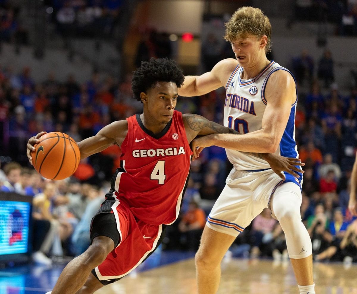 Georgia guard Marcus Millender (4) drives on Florida forward Thomas Haugh (10) during the first half of an NCAA basketball game at Steven C. O'Connell Center Exactek arena in Gainesville, FL on Tuesday, January 6, 2026. [Alan Youngblood/Gainesville Sun]