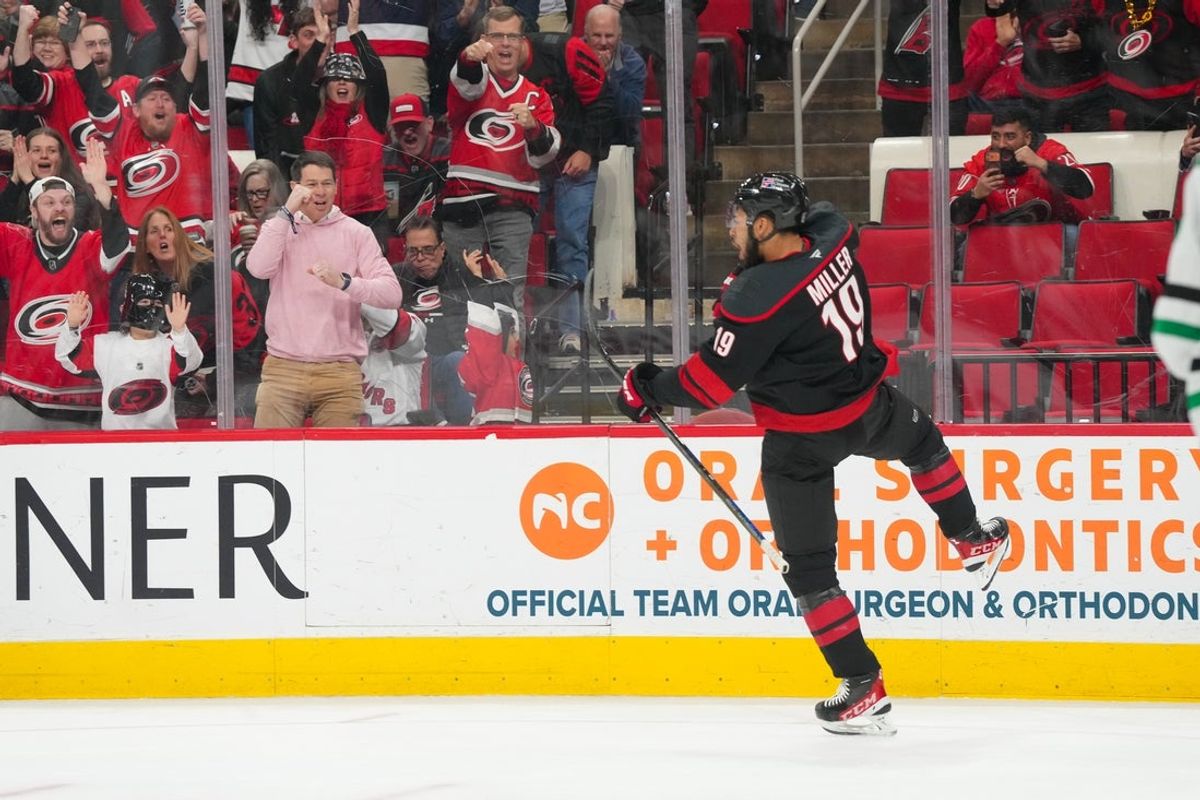 Jan 6, 2026; Raleigh, North Carolina, USA;  Carolina Hurricanes defenseman K'andre Miller (19) celebrates his goal against the Dallas Stars during the first period at Lenovo Center. Mandatory Credit: James Guillory-Imagn Images
