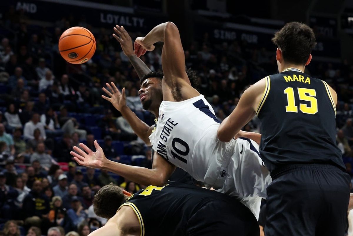 Jan 6, 2026; University Park, Pennsylvania, USA; Penn State Nittany Lions forward Josh Reed (10) reaches for the rebound during the first half against the Michigan Wolverines at Bryce Jordan Center. Mandatory Credit: Matthew O'Haren-Imagn Images