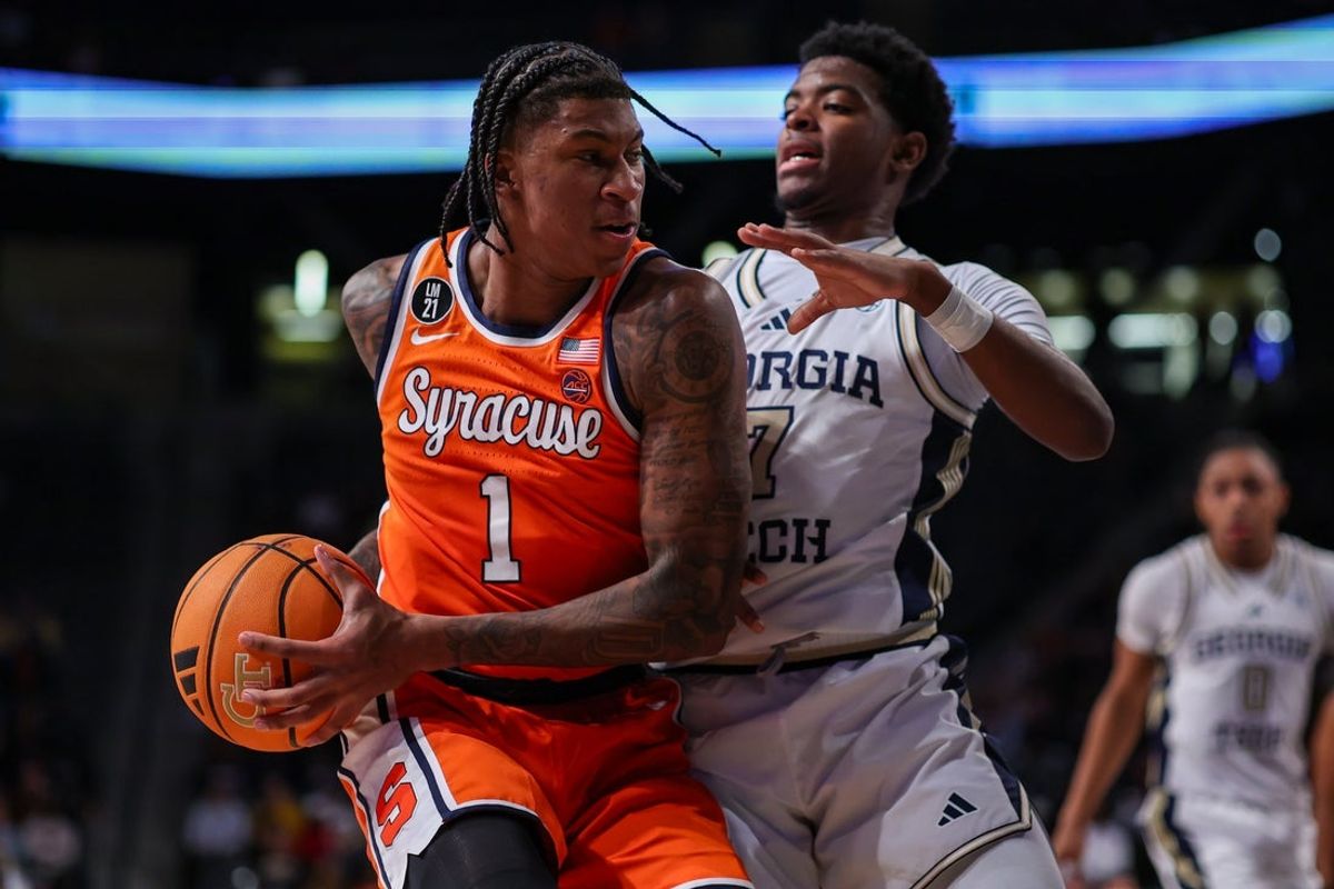 Jan 6, 2026; Atlanta, Georgia, USA; Syracuse Orange forward Donnie Freeman (1) is defended by Georgia Tech Yellow Jackets guard Chas Kelley III (7) in the first half at McCamish Pavilion. Mandatory Credit: Brett Davis-Imagn Images