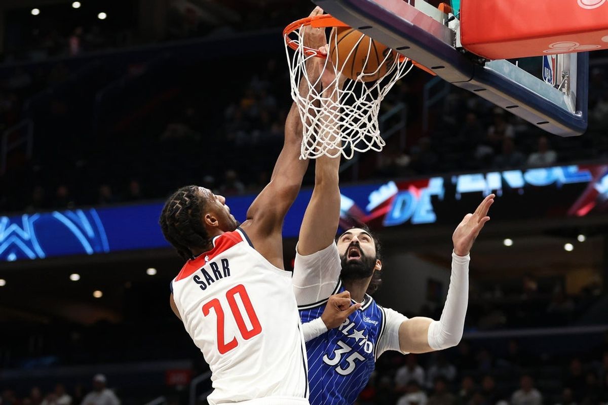 Jan 6, 2026; Washington, District of Columbia, USA; Orlando Magic center Goga Bitadze (35) dunks the ball over Washington Wizards center Alex Sarr (20) during the first half at Capital One Arena. Mandatory Credit: Daniel Kucin Jr.-Imagn Images