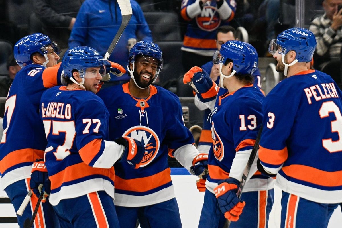 Jan 6, 2026; Elmont, New York, USA;  New York Islanders left wing Anthony Duclair (11) celebrates hit 3rd goal of the game against the New Jersey Devils with New York Islanders defenseman Tony Deangelo (77), New York Islanders defenseman Adam Pelech (3), New York Islanders center Mathew Barzal (13) and New York Islanders left wing Anders Lee (27) during the second period at UBS Arena. Mandatory Credit: Dennis Schneidler-Imagn Images
