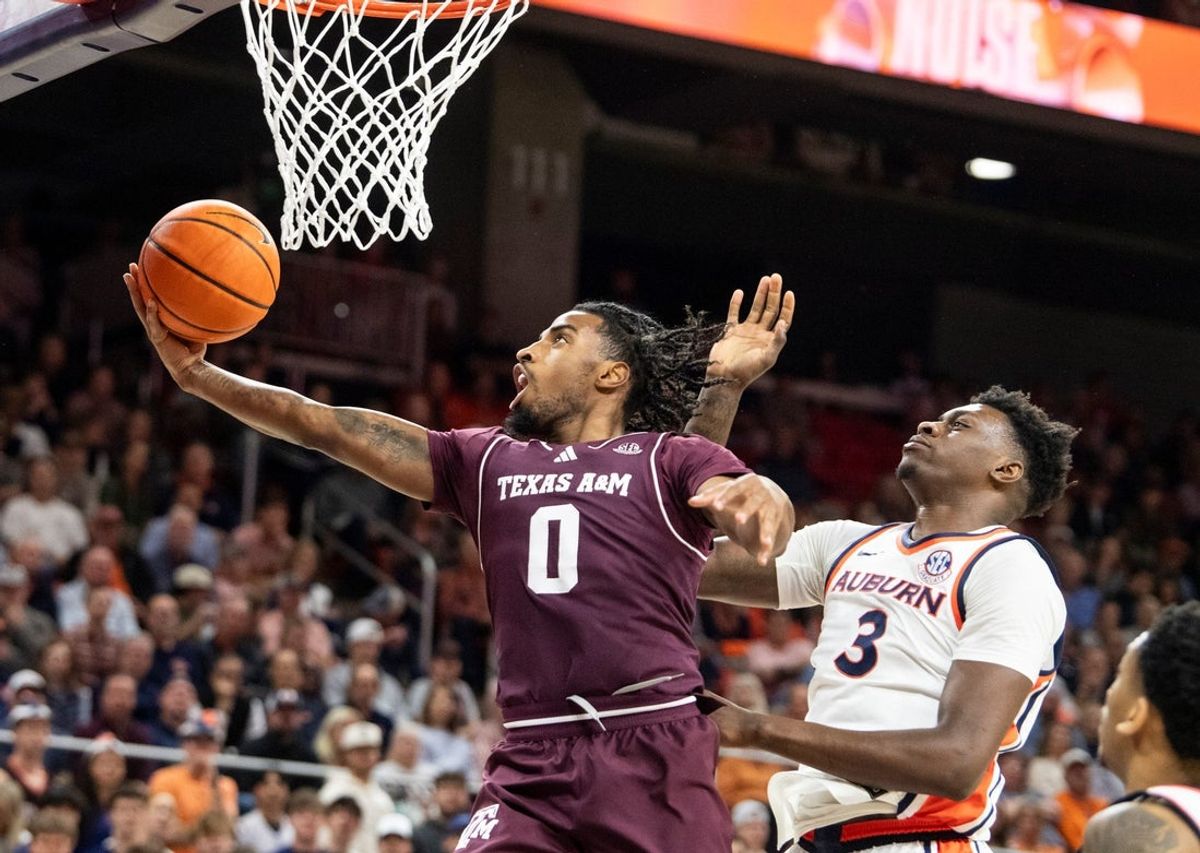 Texas A&M Aggies guard Marcus Hill (0) goes up for a layup as Auburn Tigers take on Texas A&M Aggies at Neville Arena in Auburn, Ala. on Tuesday, Jan. 6, 2026.