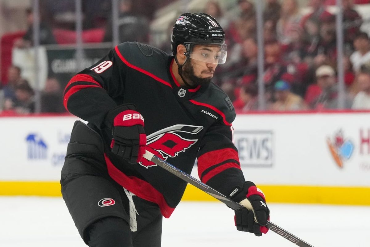 Jan 6, 2026; Raleigh, North Carolina, USA;  Carolina Hurricanes defenseman K'andre Miller (19) takes a shot against the Dallas Stars during the third period at Lenovo Center. Mandatory Credit: James Guillory-Imagn Images