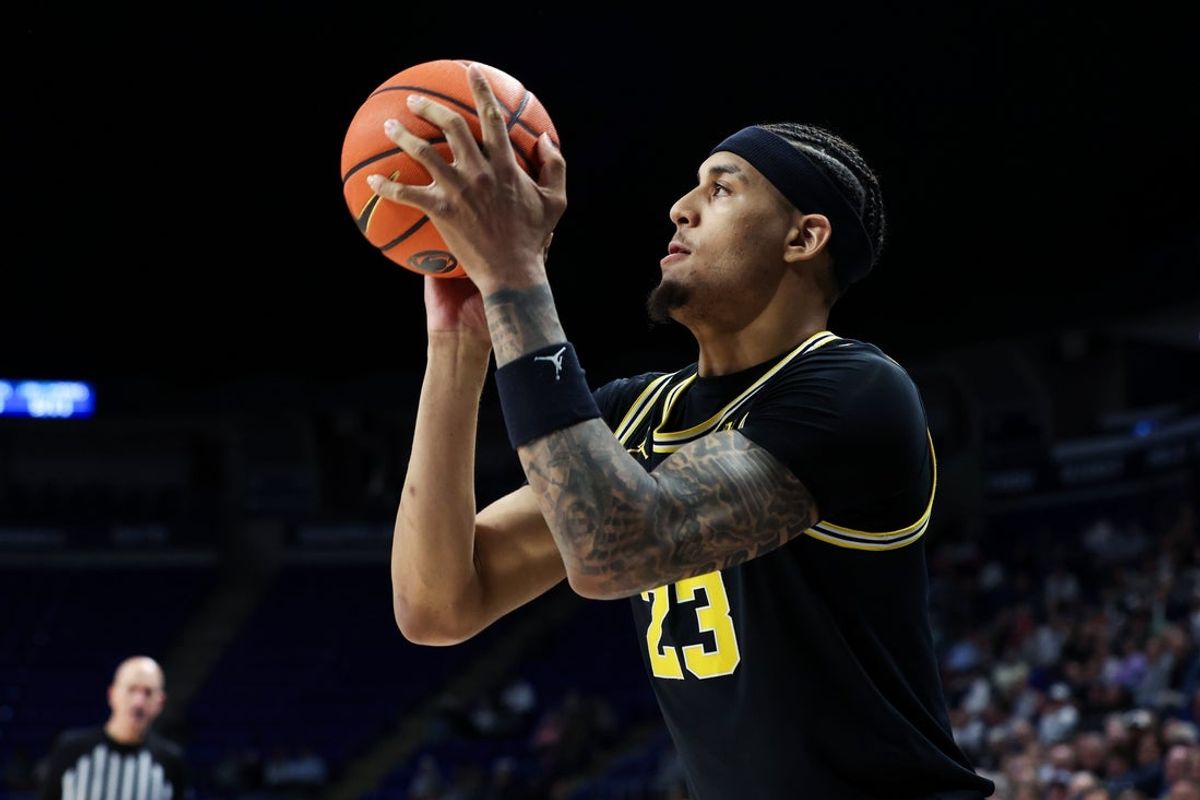 Jan 6, 2026; University Park, Pennsylvania, USA; Michigan Wolverines forward Yaxel Lendeborg (23) shoots the ball during the second half against the Penn State Nittany Lions at Bryce Jordan Center. Mandatory Credit: Matthew O'Haren-Imagn Images