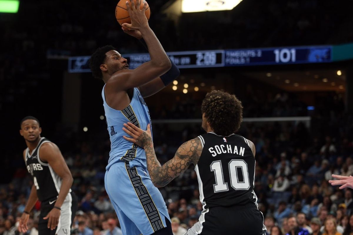 Jan 6, 2026; Memphis, Tennessee, USA; Memphis Grizzlies forward Jaren Jackson Jr. (8) shoots as San Antonio Spurs forward Jeremy Sochan (10) defends during the fourth quarter at FedExForum. Mandatory Credit: Petre Thomas-Imagn Images