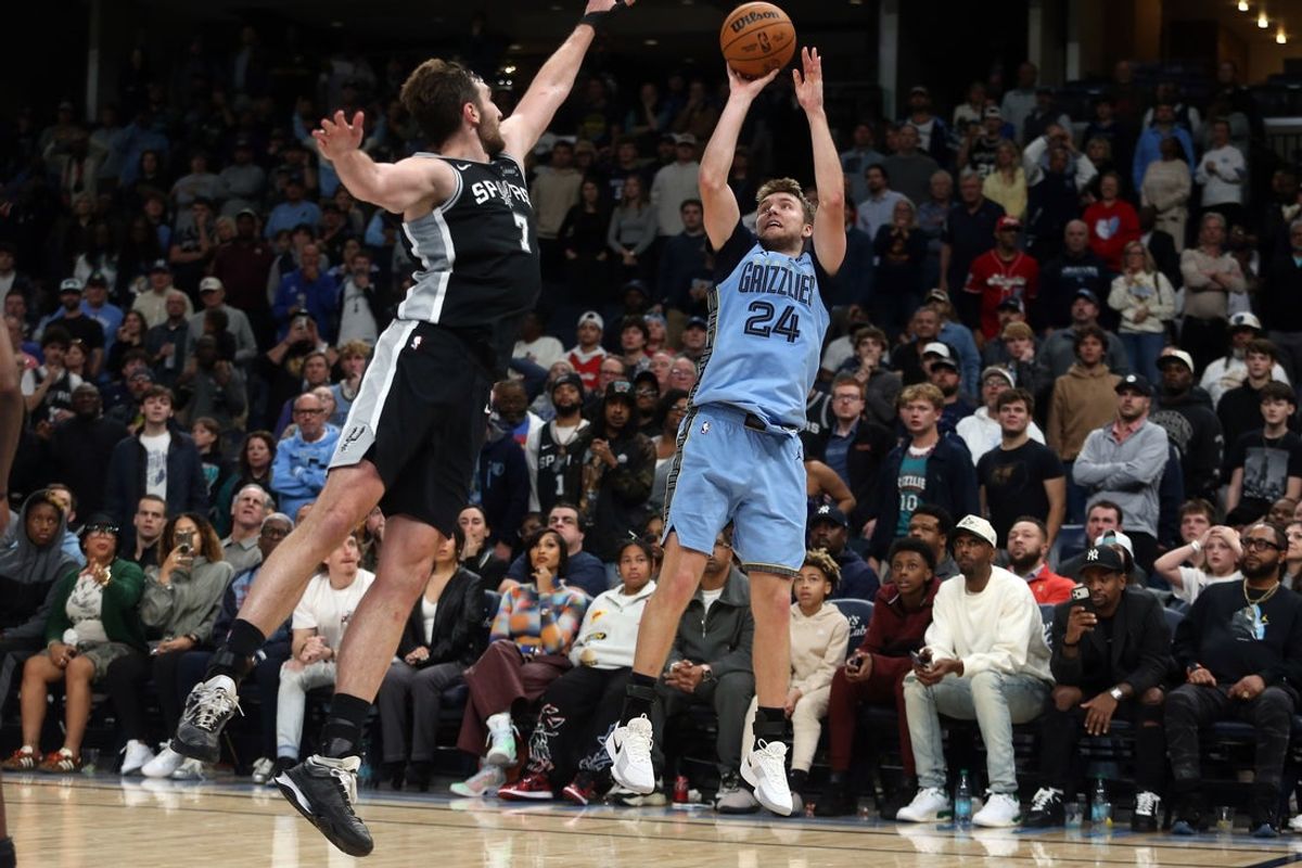 Jan 6, 2026; Memphis, Tennessee, USA; Memphis Grizzlies guard Cam Spencer (24) shoots the game winning shot during the fourth quarter against the San Antonio Spurs at FedExForum. Mandatory Credit: Petre Thomas-Imagn Images