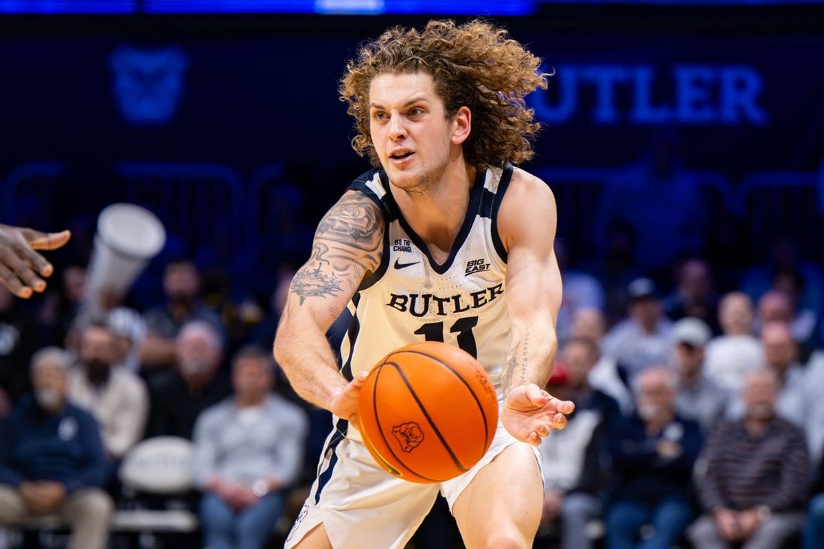 Butler Bulldogs guard Finley Bizjack (11) makes a pass during the first half of an NCAA basketball game against the St. John's Red Storm, Tuesday, Jan. 6, 2026, in Indianapolis.