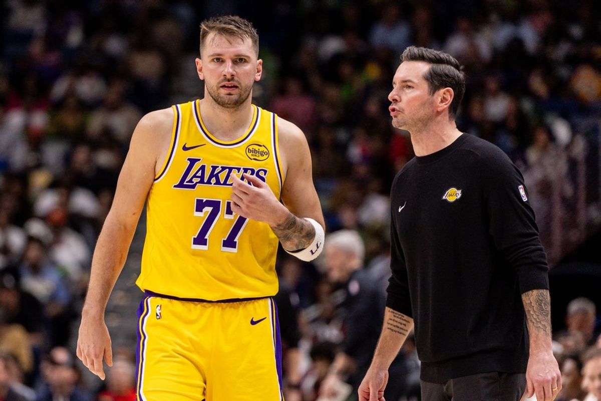 Jan 6, 2026; New Orleans, Louisiana, USA;  Los Angeles Lakers forward/guard Luka Doncic (77) talks to Head Coach JJ Redick against the New Orleans Pelicans during the second half at Smoothie King Center. Mandatory Credit: Stephen Lew-Imagn Images