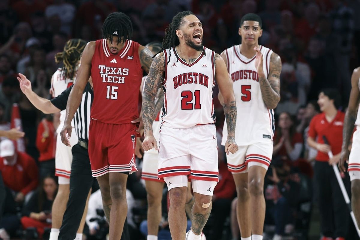 Jan 6, 2026; Houston, Texas, USA; Houston Cougars guard Emanuel Sharp (21) reacts after a play during the second half against the Texas Tech Red Raiders at Fertitta Center. Mandatory Credit: Troy Taormina-Imagn Images