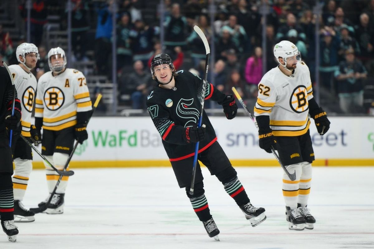 Jan 6, 2026; Seattle, Washington, USA; Seattle Kraken center Berkly Catton (27) skates around after scoring his first NHL goal during the second period against the Boston Bruins at Climate Pledge Arena. Mandatory Credit: Steven Bisig-Imagn Images