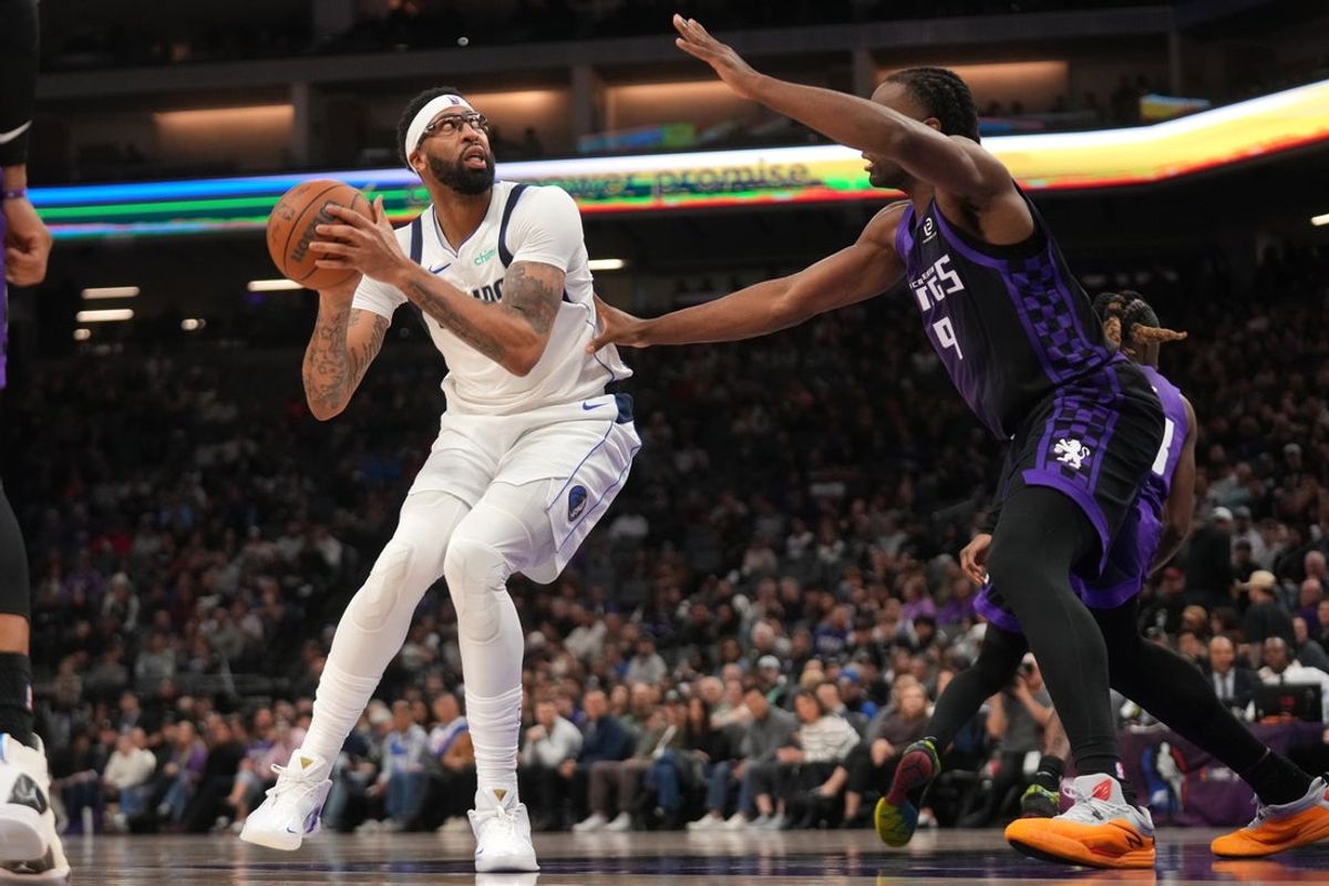 Jan 6, 2026; Sacramento, California, USA; Dallas Mavericks forward Anthony Davis (3) holds onto the ball next to Sacramento Kings forward Precious Achiuwa (9) in the second quarter at the Golden 1 Center. Mandatory Credit: Cary Edmondson-Imagn Images