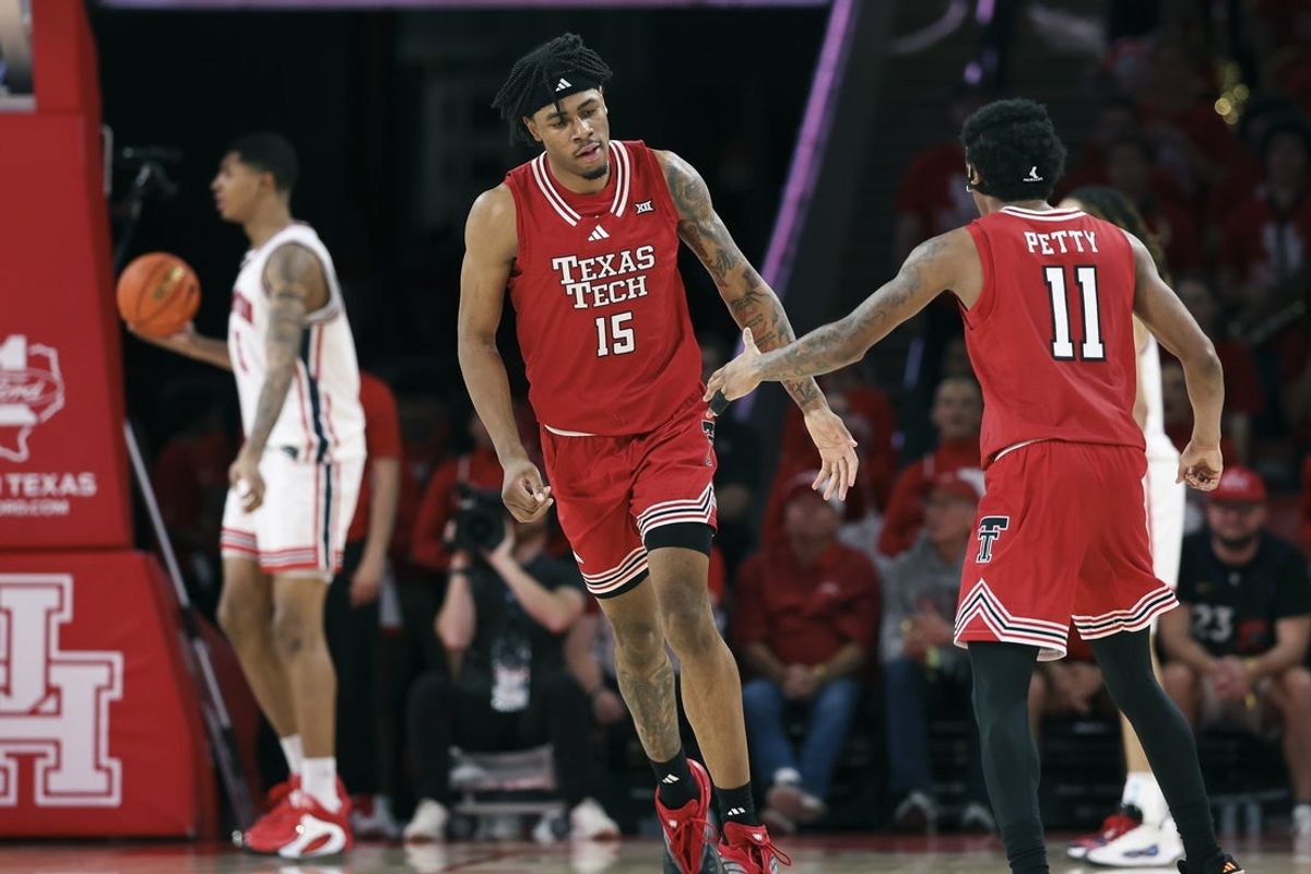 Jan 6, 2026; Houston, Texas, USA; Texas Tech Red Raiders forward JT Toppin (15) celebrates with guard Jaylen Petty (11) after a play during the second half against the Houston Cougars at Fertitta Center. Mandatory Credit: Troy Taormina-Imagn Images
