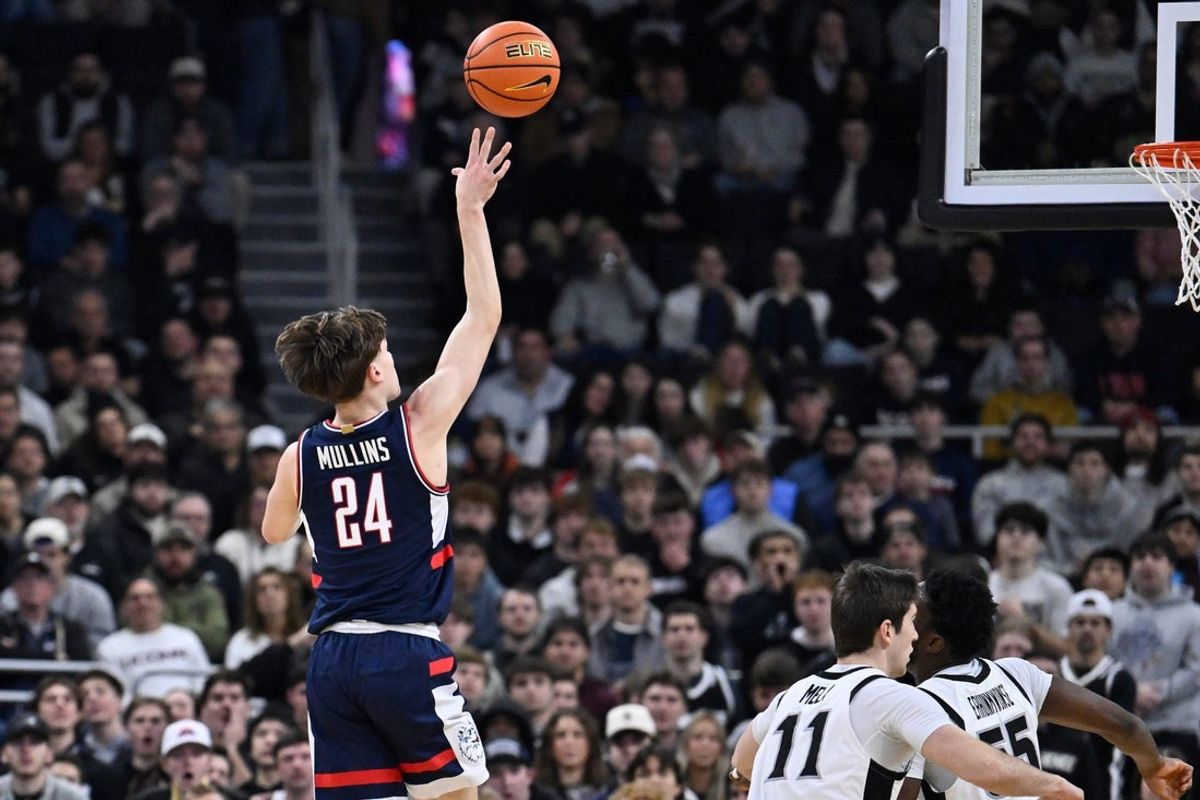Jan 7, 2026; Providence, Rhode Island, USA; UConn Huskies guard Braylon Mullins (24) shoots the ball against the Providence Friars during the first half at Amica Mutual Pavilion. Mandatory Credit: Eric Canha-Imagn Images