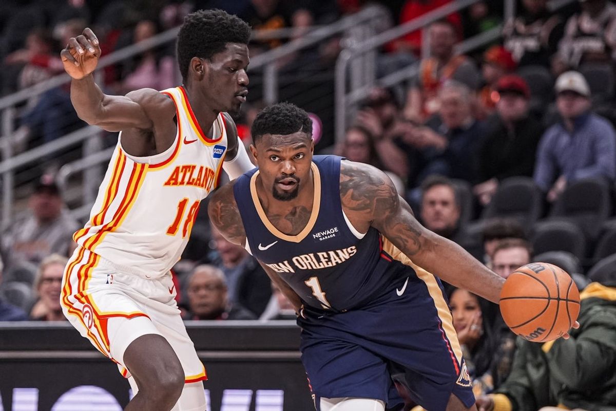 Jan 7, 2026; Atlanta, Georgia, USA; New Orleans Pelicans forward Zion Williamson (1) dribbles against Atlanta Hawks forward Mouhamed Gueye (18) during the first half at State Farm Arena. Mandatory Credit: Dale Zanine-Imagn Images